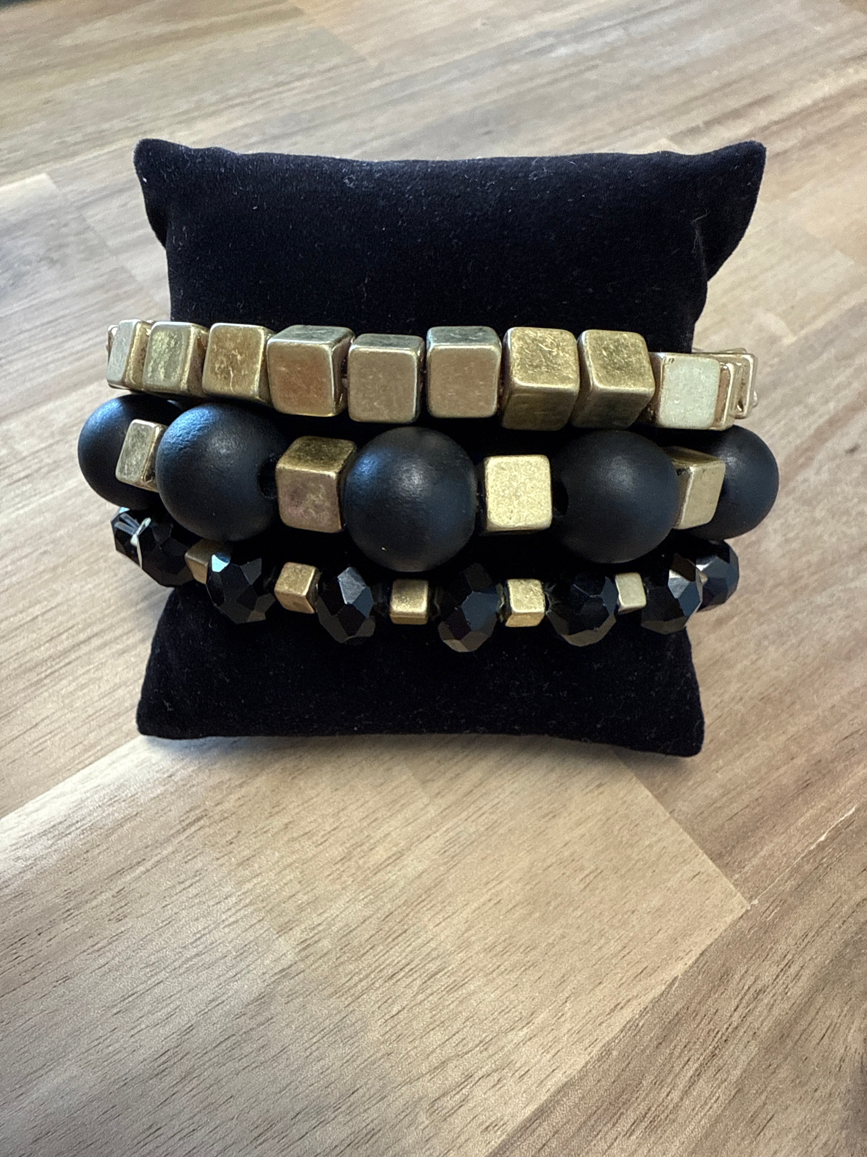 MEGHAN BROWNE BLACK AND GOLD BRACELET