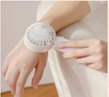 MINI HANDHELD COOLING FAN WITH COOL-TOUCH